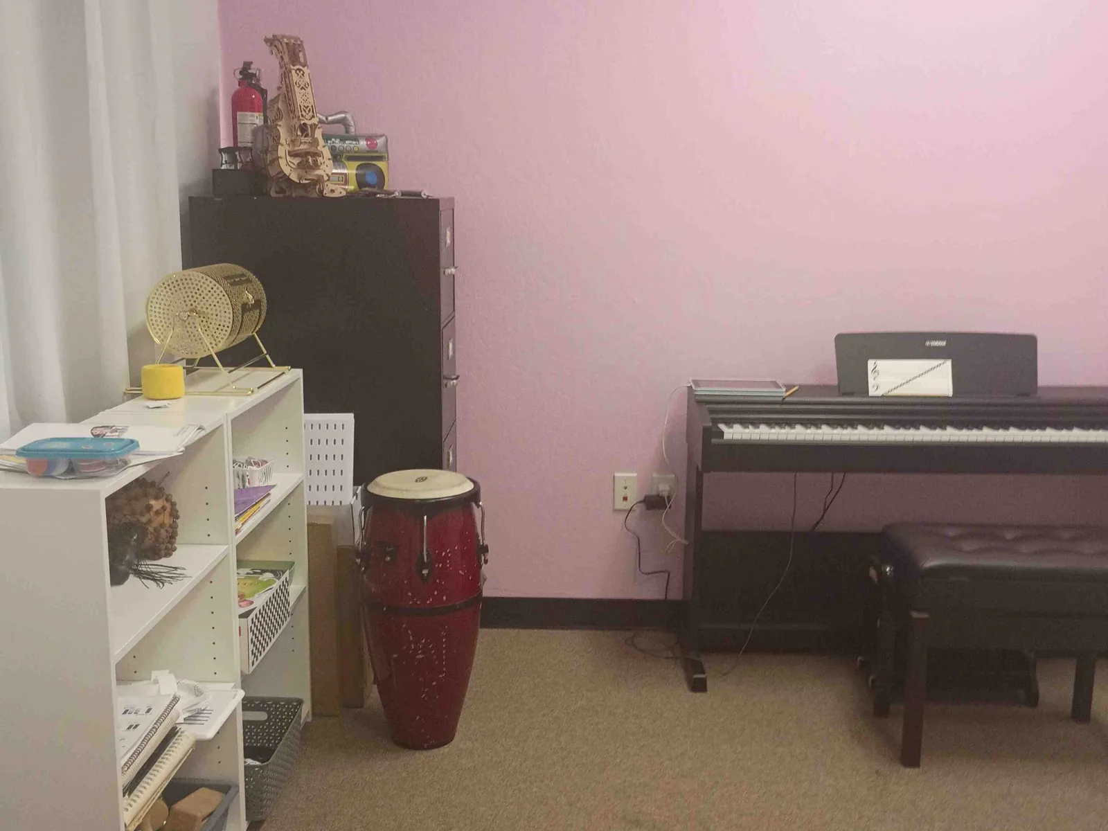 Clean instruction room with a piano and percussion instruments at Teachout Music Studio in Sparks.